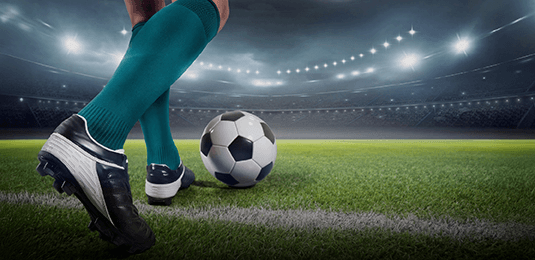 kicking a soccer ball